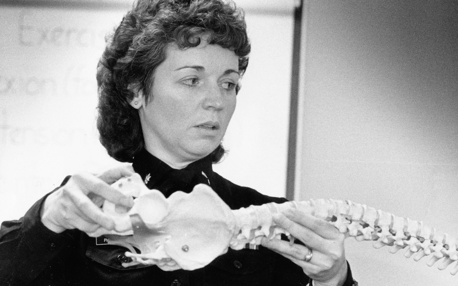 Reviewing a spine model during a consultation
